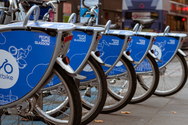 photo of blue bike wheels in glasgow with white text 