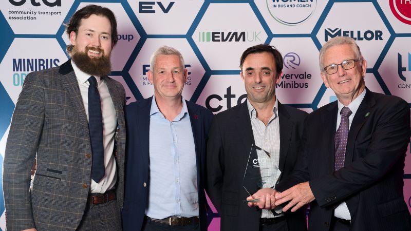 winners stand with their award