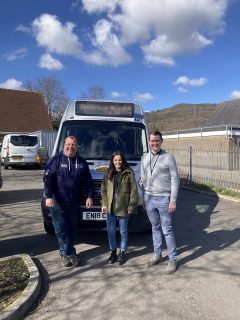 Parish Trust Shuttle Bus team small in front of minibus