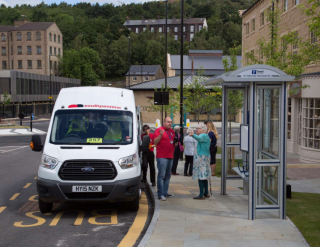 a-group-of-people-boarding-a-minibus