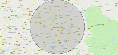 image shows a map with a large grey circle highlighting Manchester