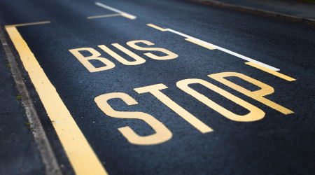 painted bus stop on road