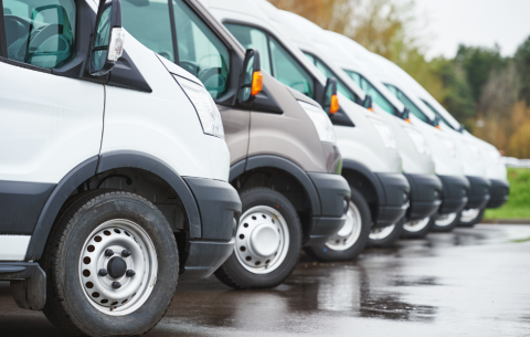 Image of various vehicles lined up beside eachother parked