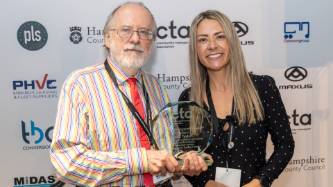 John receiving the Lifetime Achievement Award at the 2024 MiDAS Awards, alongside CTA Chief Executive Victoria Armstrong.