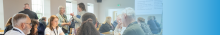 a group of people talking around a conference table